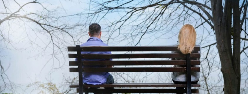 couple-on-bench-far-apart